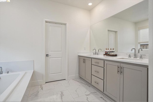 bathroom with vanity and a bathing tub