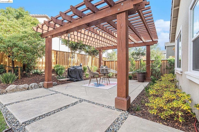 view of patio with a pergola and area for grilling