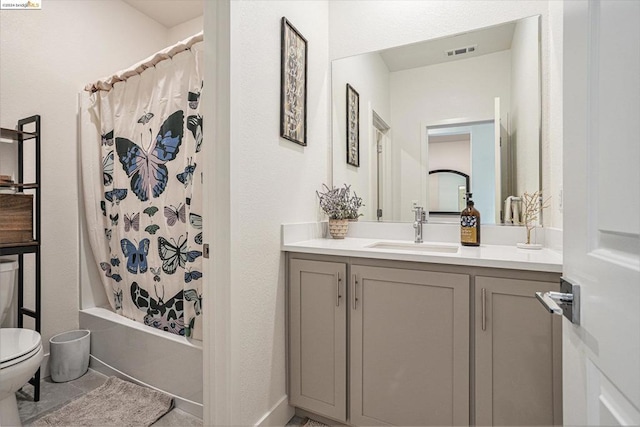 full bathroom featuring toilet, vanity, and shower / bath combo with shower curtain