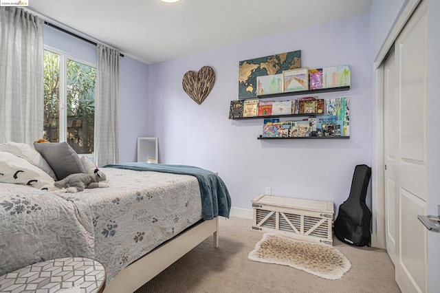 bedroom featuring a closet and carpet flooring