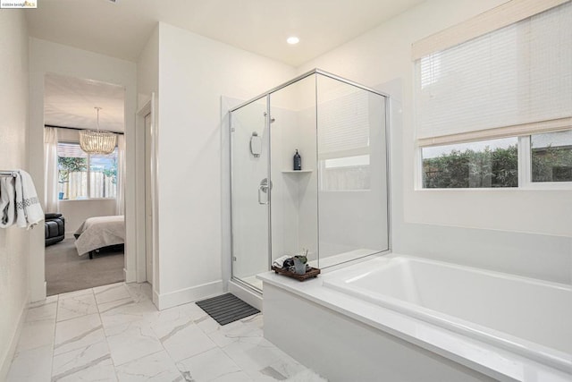 bathroom with a notable chandelier and plus walk in shower