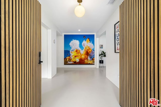 hallway with concrete floors