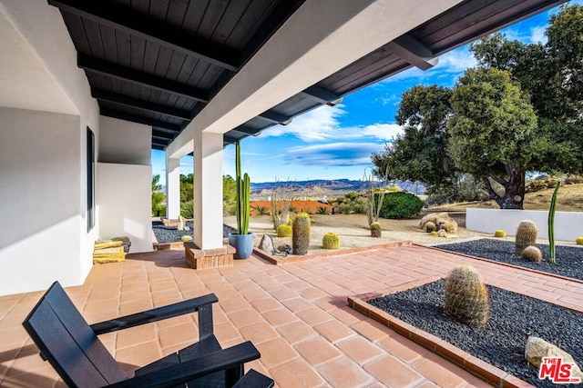 view of patio with a mountain view