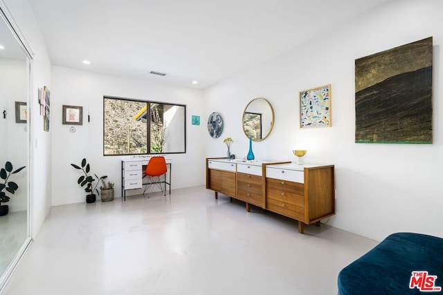 sitting room with concrete floors