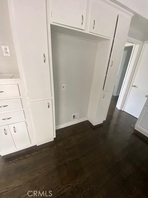 interior space featuring a closet and dark hardwood / wood-style flooring