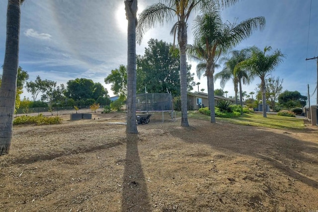 view of yard featuring a trampoline