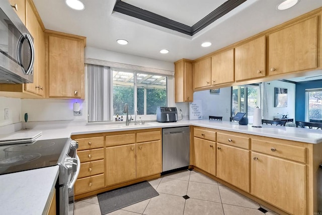 kitchen with sink, crown molding, light brown cabinetry, light tile patterned flooring, and stainless steel appliances