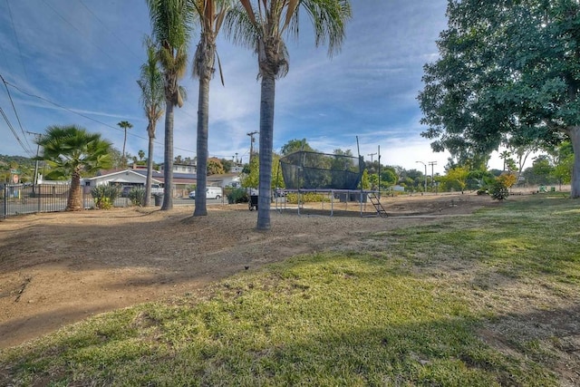 view of yard with a trampoline