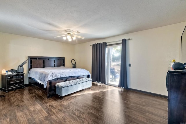 bedroom featuring a textured ceiling, ceiling fan, and dark wood-type flooring