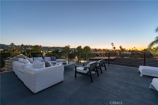 patio terrace at dusk with an outdoor living space