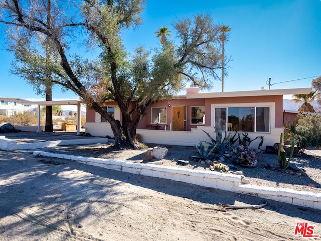 single story home with a carport