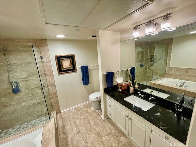 full bathroom featuring toilet, vanity, and separate shower and tub