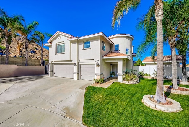 view of front of home featuring a front lawn and a garage