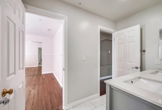 bathroom with vanity and hardwood / wood-style flooring