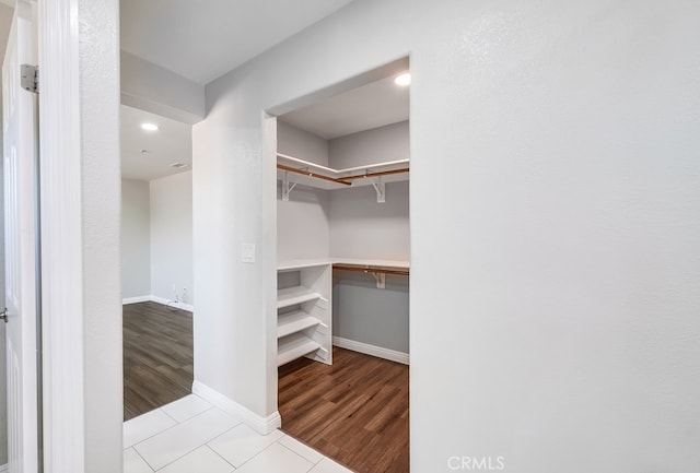 spacious closet featuring light tile patterned floors