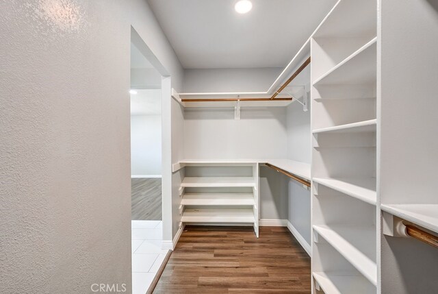 spacious closet with wood-type flooring