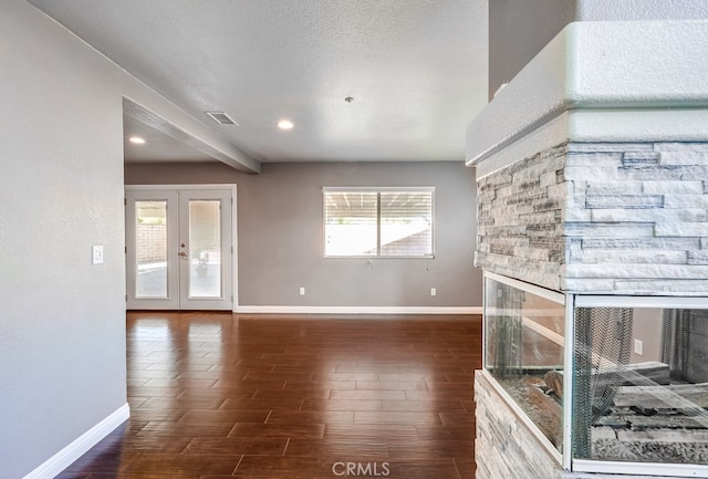 unfurnished living room with french doors