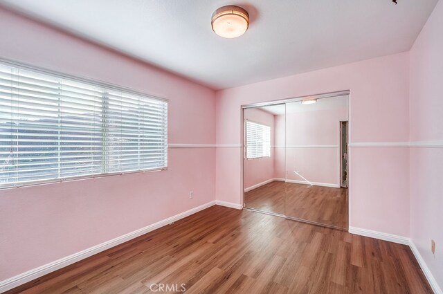 spare room featuring hardwood / wood-style flooring