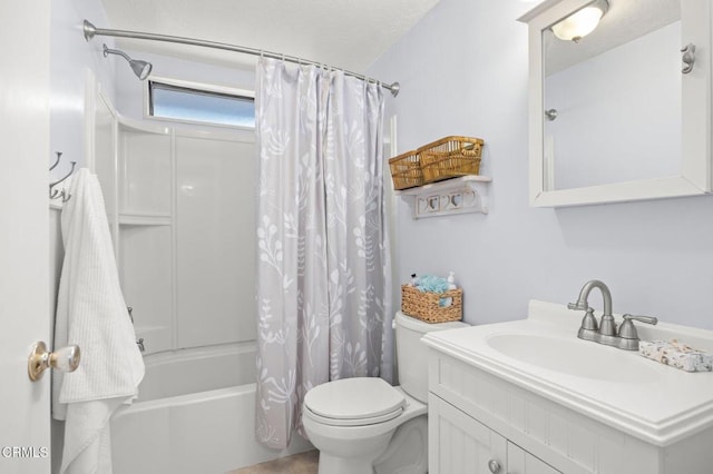 full bathroom with shower / tub combo with curtain, vanity, and toilet