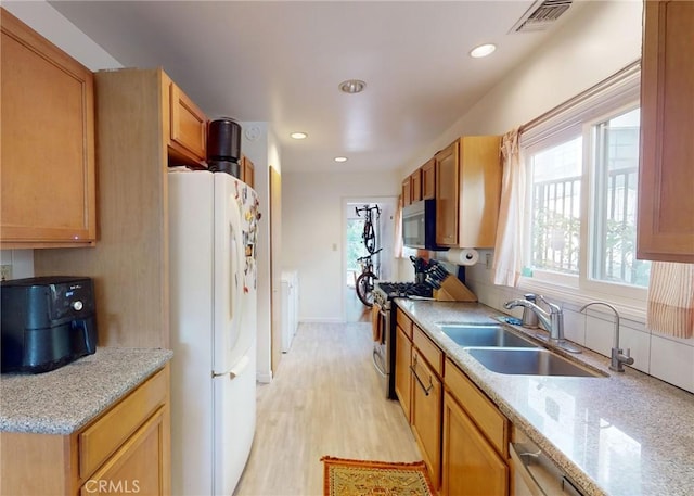 2049 Argyle Ave, Los Angeles, CA 90068 - kitchen with appliances with stainless steel finishes, light wood-type flooring, and recessed lighting