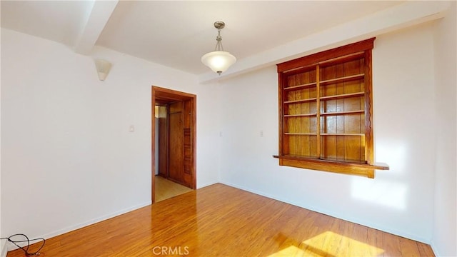 2049 Argyle Ave, Los Angeles, CA 90068 - unfurnished room featuring wood finished floors and beam ceiling