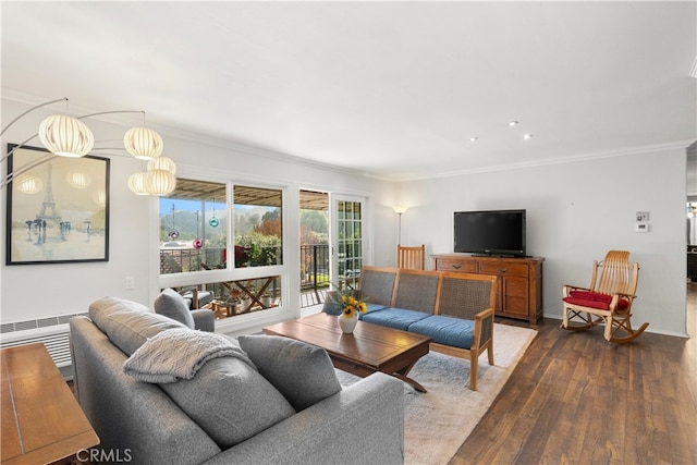 living room featuring ornamental molding and hardwood / wood-style floors