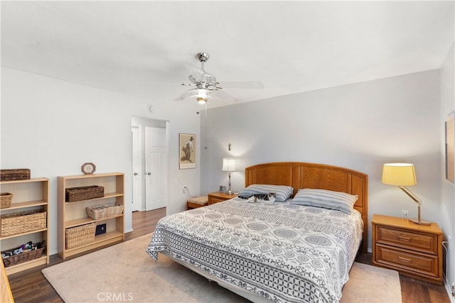 bedroom featuring ceiling fan and dark hardwood / wood-style flooring