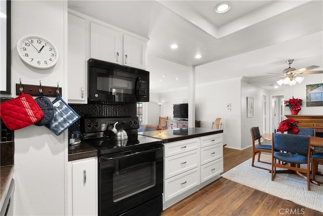 kitchen with black appliances, white cabinets, ceiling fan, and dark hardwood / wood-style floors