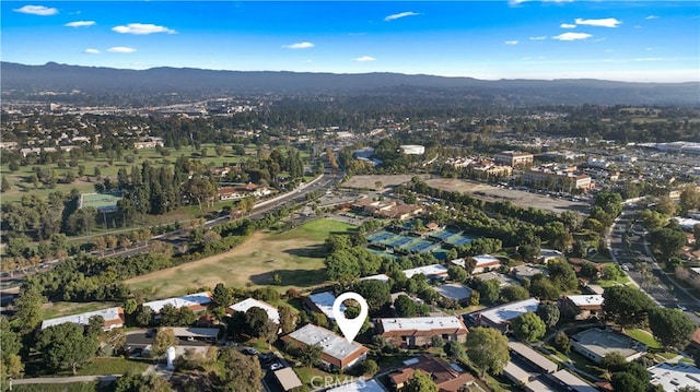 birds eye view of property featuring a mountain view