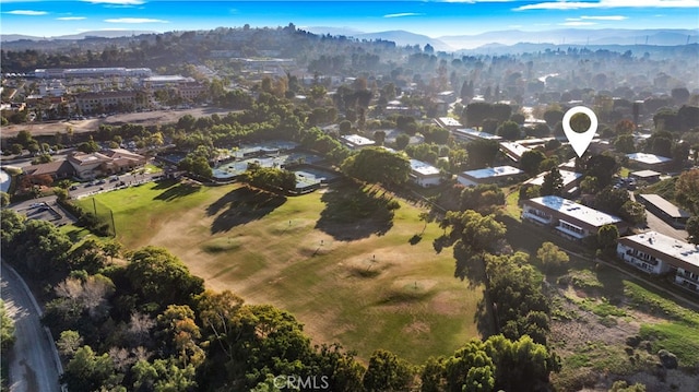 birds eye view of property with a mountain view