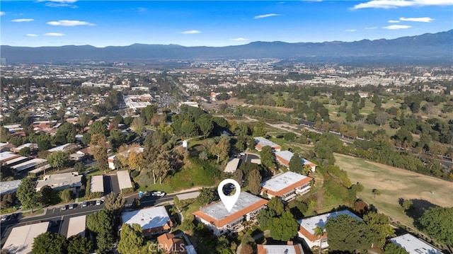 birds eye view of property featuring a mountain view