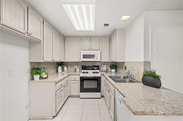 19106 Alamo Ln Unit 169, Yorba Linda, CA 92886 - kitchen featuring white appliances, decorative backsplash, light tile patterned floors, and light stone counters