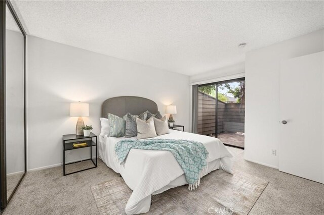 19106 Alamo Ln Unit 169, Yorba Linda, CA 92886 - carpeted bedroom featuring access to exterior and a textured ceiling