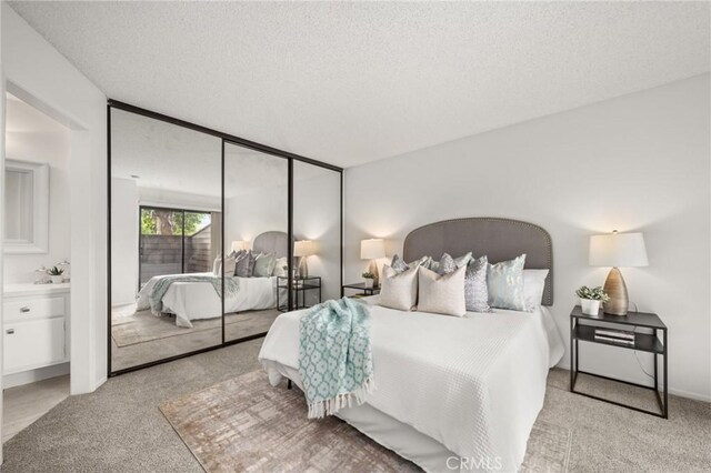 19106 Alamo Ln Unit 169, Yorba Linda, CA 92886 - carpeted bedroom featuring a textured ceiling and a closet