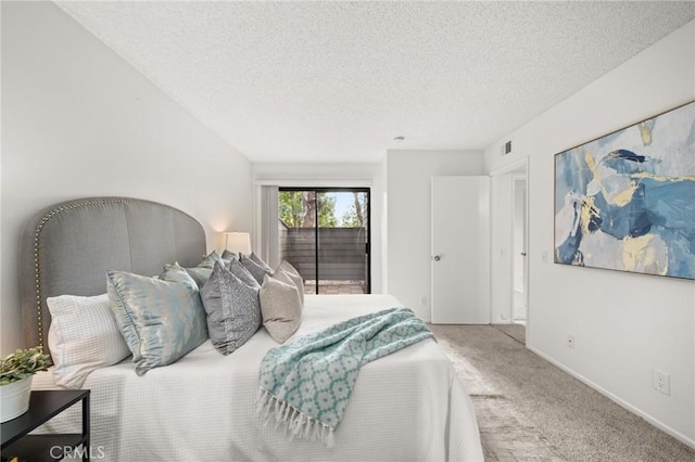 carpeted bedroom with a textured ceiling