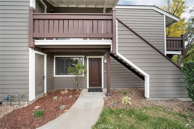 entrance to property with a balcony