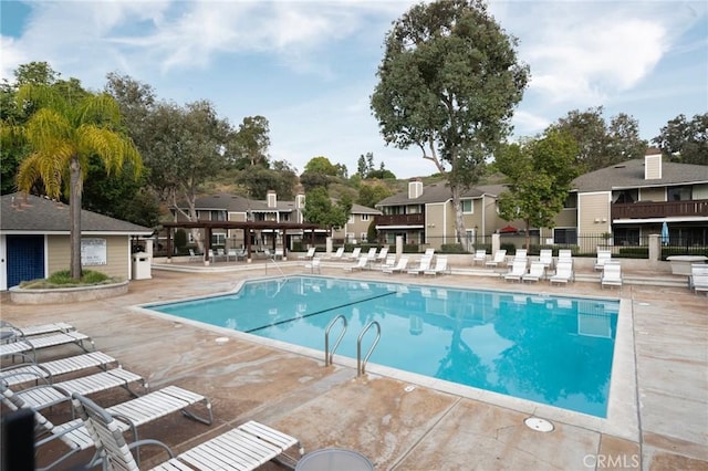 view of swimming pool with a patio area