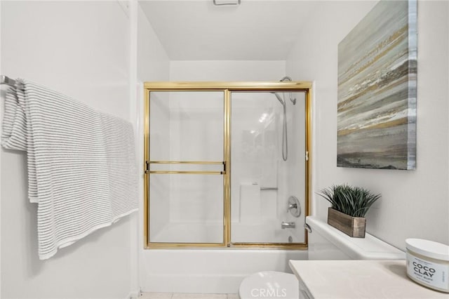 full bathroom with tile patterned flooring, vanity, toilet, and enclosed tub / shower combo