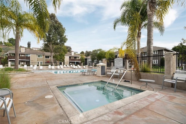 view of pool with a community hot tub