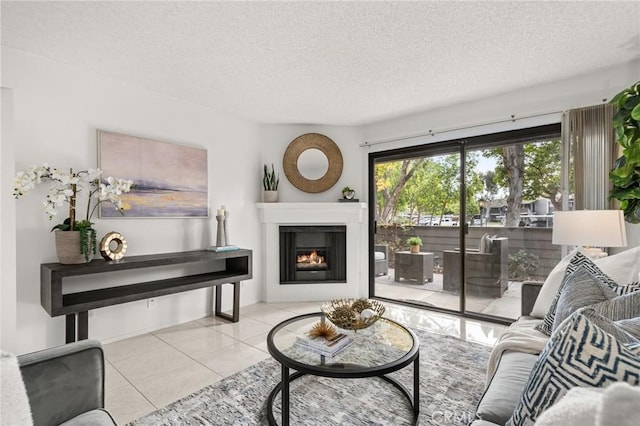 living room featuring light tile patterned floors and a textured ceiling