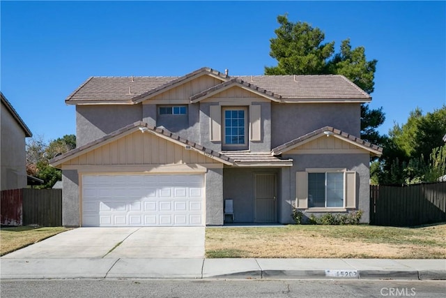 view of front of home featuring a garage and a front yard