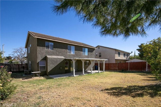 rear view of house featuring a pergola, a yard, a patio, and central AC unit