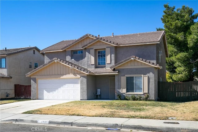 view of front of property featuring a garage and a front yard