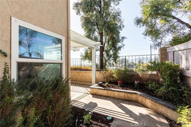 view of patio / terrace featuring a fenced backyard and a pergola