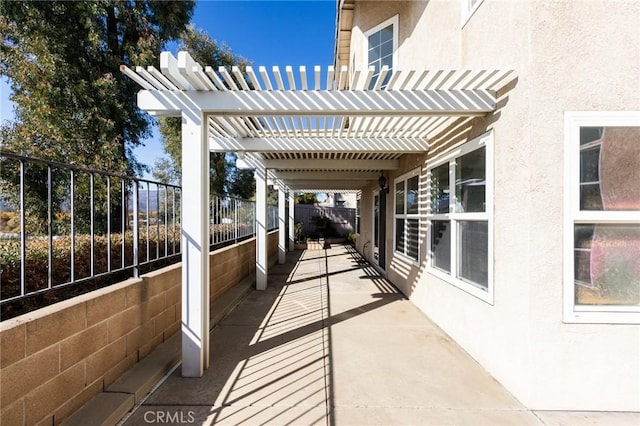 view of patio / terrace featuring fence and a pergola