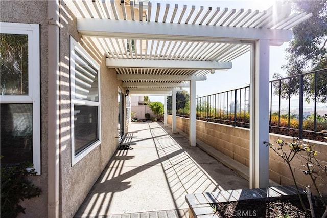 view of patio / terrace with fence and a pergola