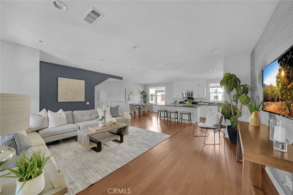 living room with light hardwood / wood-style flooring