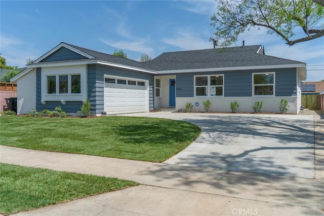 ranch-style house featuring a garage and a front yard