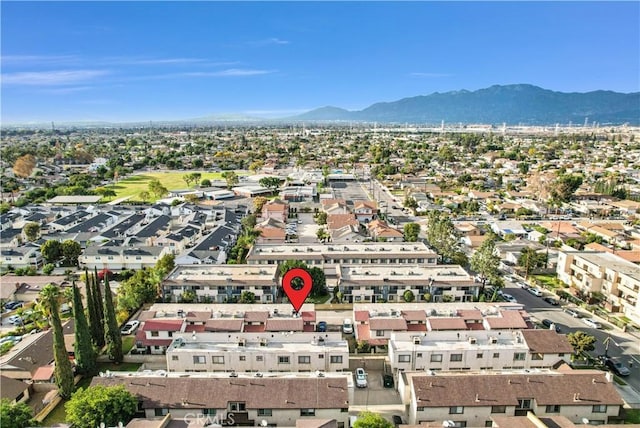 birds eye view of property with a mountain view