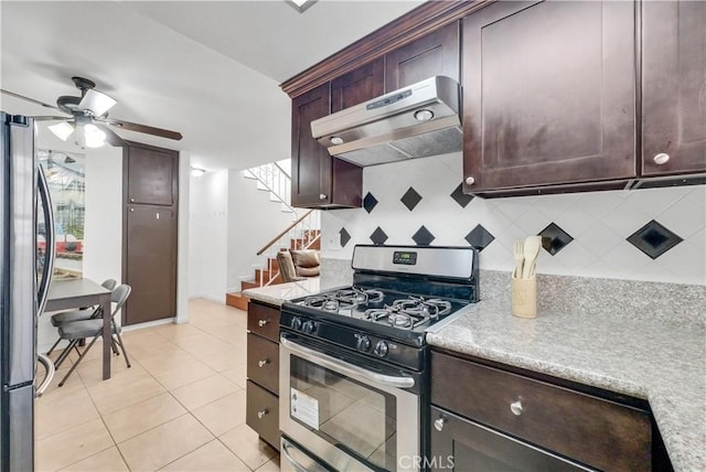 kitchen with backsplash, ventilation hood, ceiling fan, light tile patterned floors, and stainless steel appliances